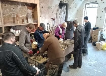 Volunteers making trench candles for Ukrainian soldiers